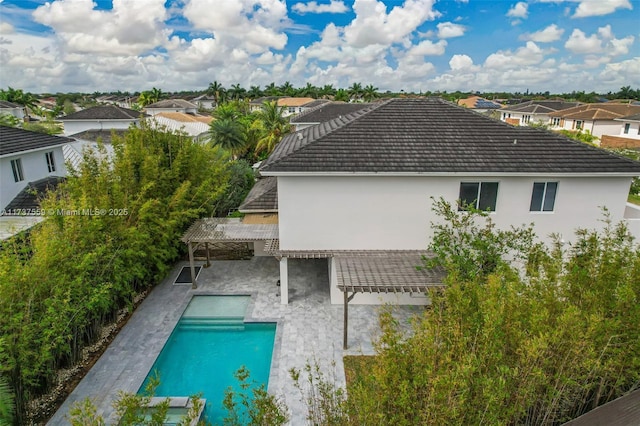 view of swimming pool featuring a patio and a pergola