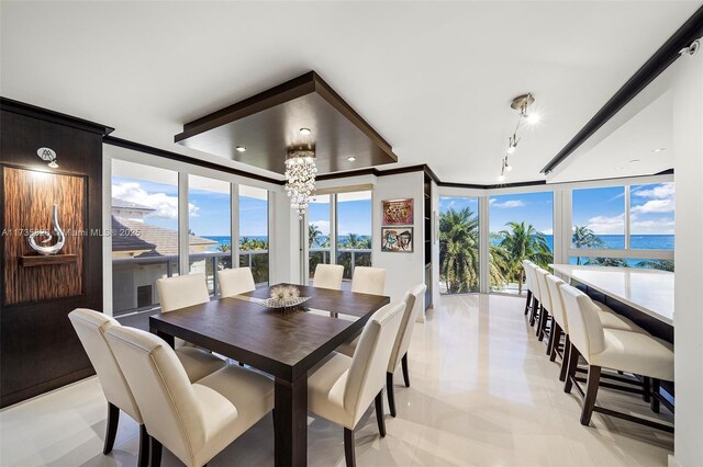 4775 Collins Ave Unit 501, Miami Beach, FL 33140 - dining space featuring a chandelier, floor to ceiling windows, and a water view