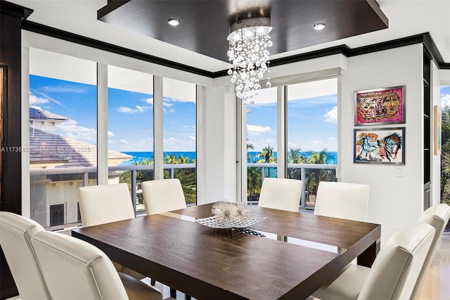 4775 Collins Ave Unit 501, Miami Beach, FL 33140 - dining space featuring a chandelier and a water view