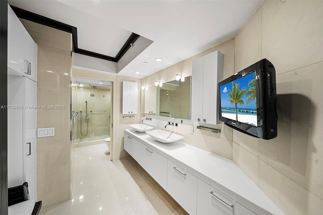 bathroom featuring walk in shower, vanity, and toilet