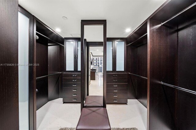 bedroom with ornamental molding and ensuite bath