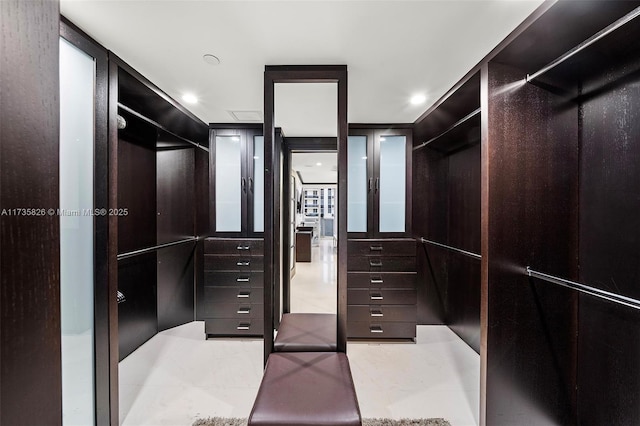 spacious closet with light tile patterned flooring