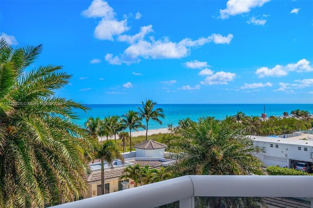 balcony featuring a water view