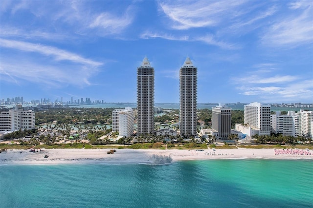 aerial view featuring a view of the beach and a water view