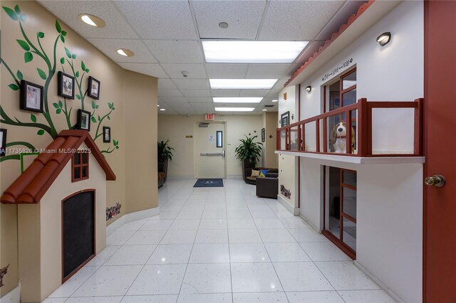 corridor featuring wood ceiling, wooden walls, and concrete flooring