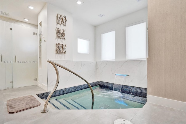 view of pool featuring an indoor hot tub