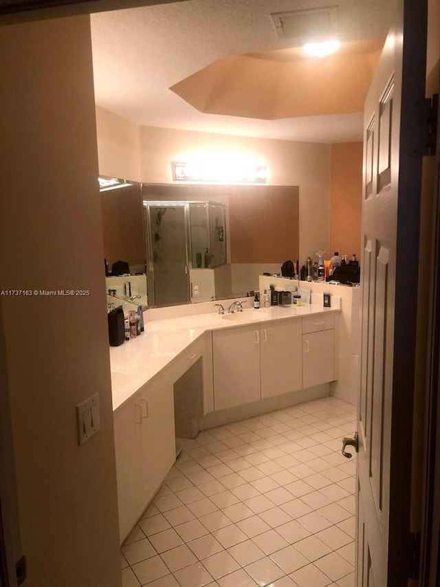 bathroom featuring vanity and tile patterned flooring