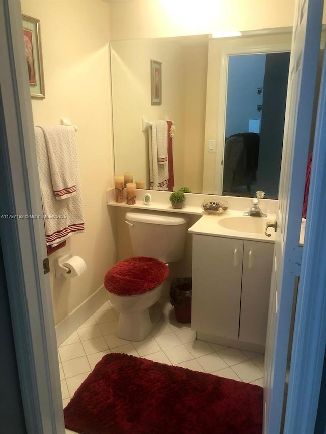 bathroom featuring tile patterned floors, toilet, and vanity