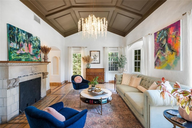 living room featuring coffered ceiling, a notable chandelier, crown molding, and a high end fireplace