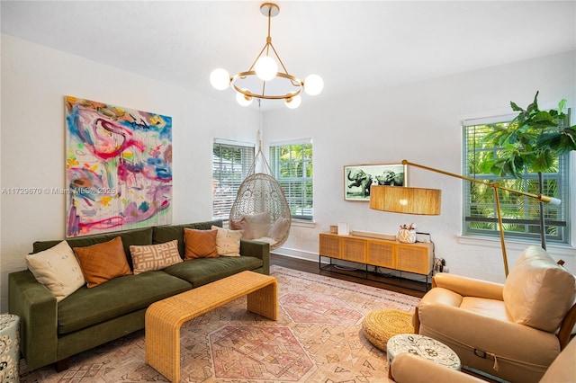 2424 Prairie Ave, Miami Beach, FL 33140 - living room featuring a chandelier, wood finished floors, and baseboards
