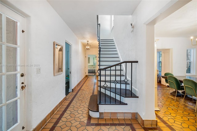 2424 Prairie Ave, Miami Beach, FL 33140 - hallway featuring stairs and tile patterned flooring