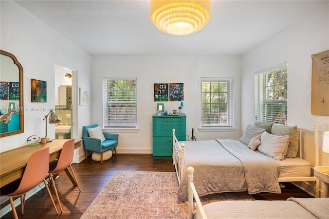2424 Prairie Ave, Miami Beach, FL 33140 - bedroom with dark wood finished floors, baseboards, and connected bathroom