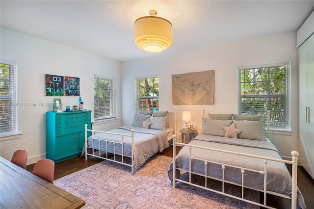 bedroom with hardwood / wood-style floors