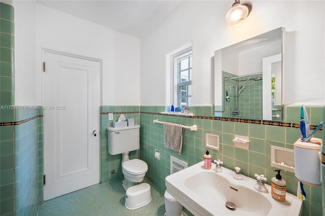 bathroom featuring tile walls, sink, toilet, and walk in shower