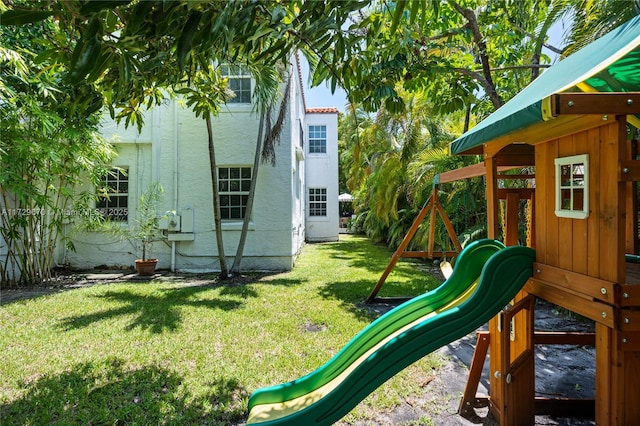 view of playground with a yard