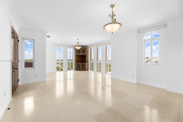 unfurnished living room with crown molding