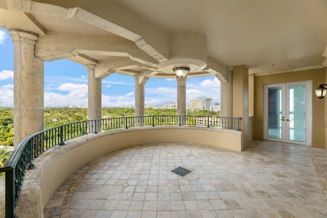 balcony with french doors and a patio