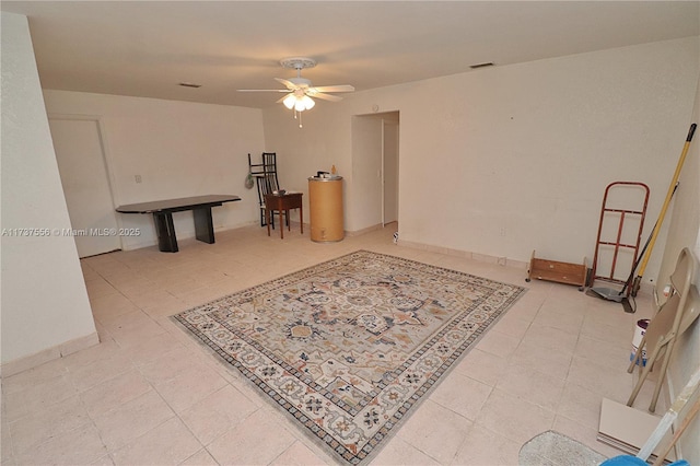 interior space with tile patterned floors and ceiling fan