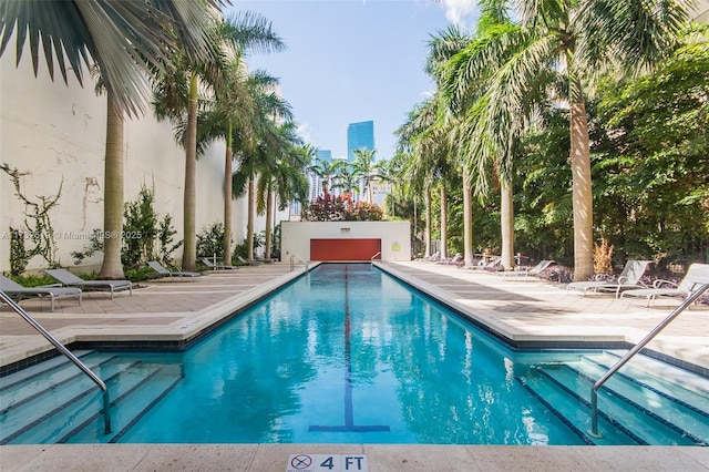 view of swimming pool with a patio