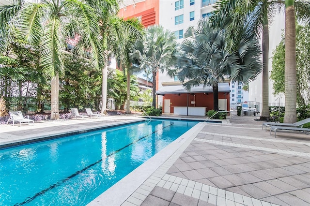 view of swimming pool with a patio