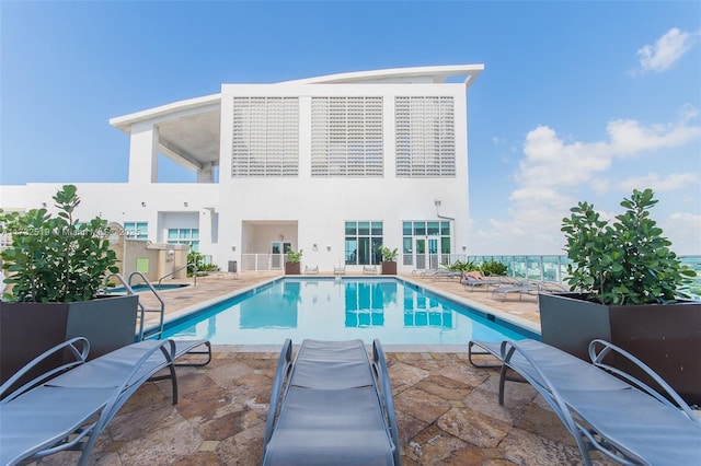 view of swimming pool featuring a patio