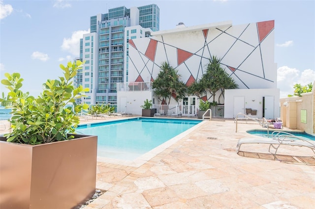 view of swimming pool featuring a patio area