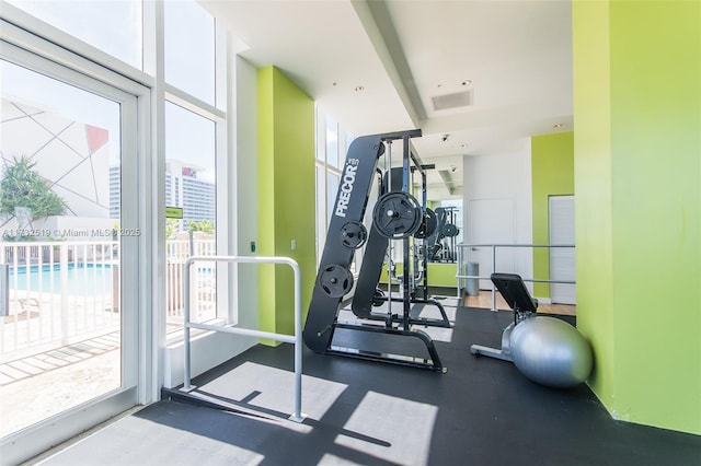 gym featuring a wall of windows