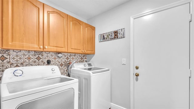 laundry room featuring washer and dryer and cabinet space