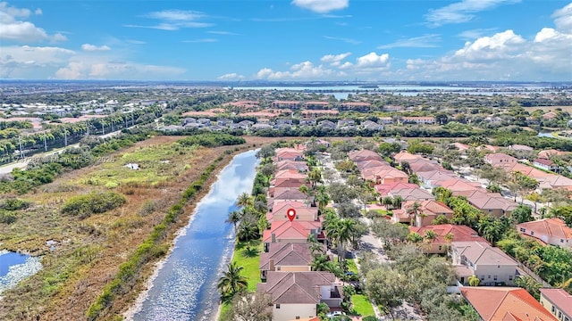 bird's eye view featuring a water view and a residential view