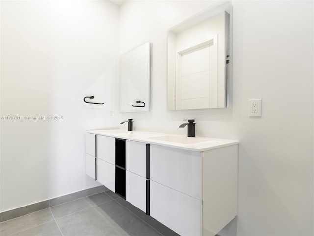 bathroom featuring tile patterned flooring and vanity