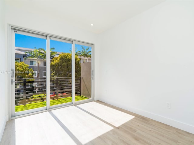 empty room with light hardwood / wood-style floors