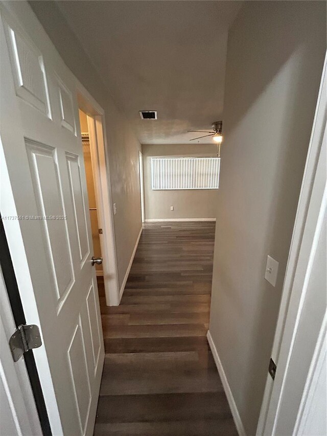 7403 Foxbloom Dr, New Port Richey, FL 34668 - stairway with a ceiling fan, baseboards, and wood finished floors
