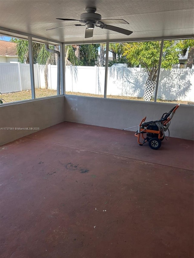 7403 Foxbloom Dr, New Port Richey, FL 34668 - unfurnished sunroom featuring a ceiling fan and plenty of natural light
