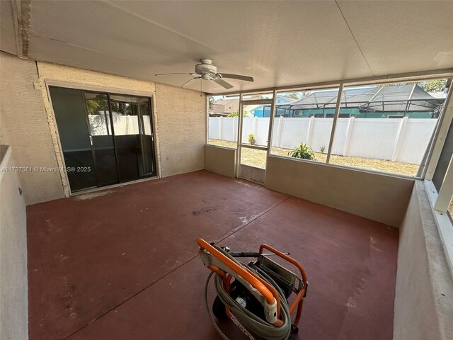7403 Foxbloom Dr, New Port Richey, FL 34668 - unfurnished sunroom with a ceiling fan