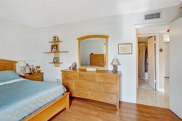 bedroom featuring light hardwood / wood-style flooring