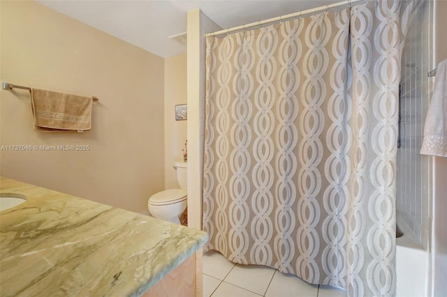 bathroom featuring vanity, toilet, and tile patterned flooring