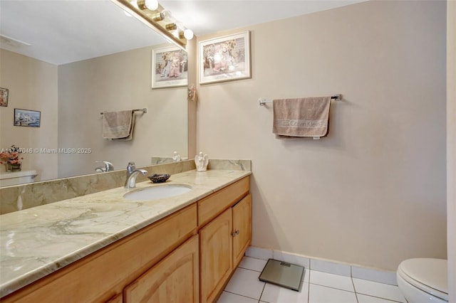 bathroom featuring tile patterned floors, toilet, and vanity