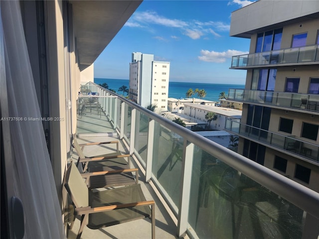 balcony featuring a water view