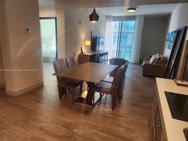 dining area featuring dark hardwood / wood-style floors