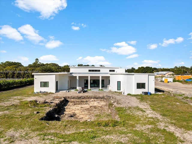 back of house featuring a patio area