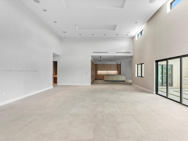 17301 SW 52nd Ct, Southwest Ranches, FL 33331 - unfurnished living room with baseboards and a towering ceiling