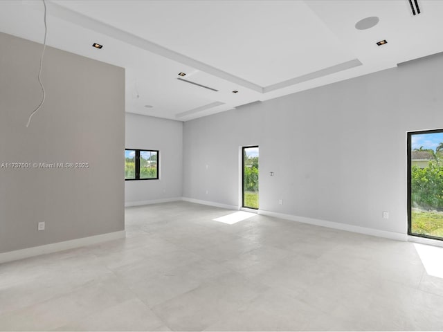 spare room with a towering ceiling