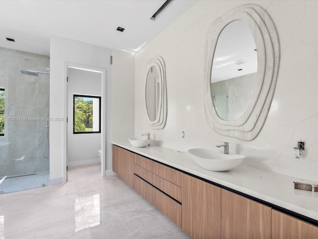 bathroom featuring vanity, an enclosed shower, and toilet