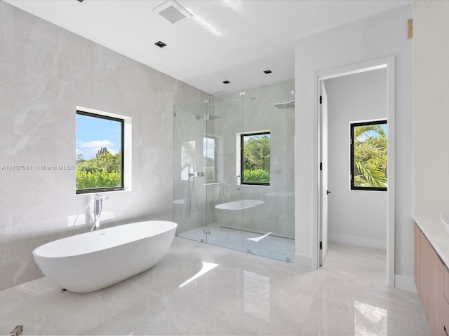 17301 SW 52nd Ct, Southwest Ranches, FL 33331 - full bathroom with marble finish floor, a freestanding tub, visible vents, and a stall shower