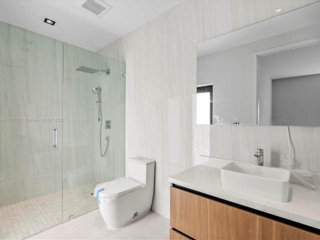 bathroom with toilet, an enclosed shower, tile walls, vanity, and decorative backsplash