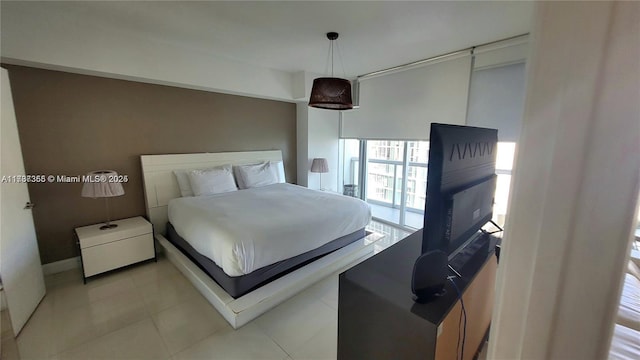 bedroom with light tile patterned floors