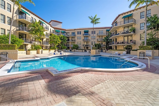 pool featuring a patio area