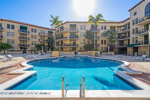 55 Merrick Way Unit 624, Coral Gables, FL 33134 - community pool featuring a patio