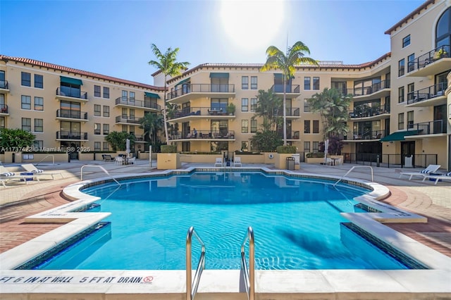 community pool featuring a patio