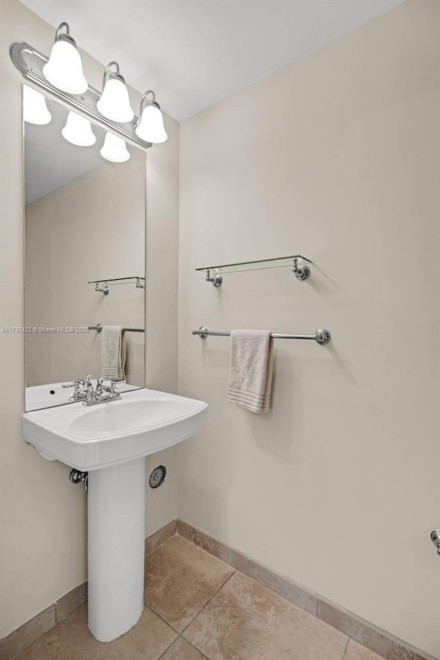 bathroom featuring tile patterned flooring and baseboards